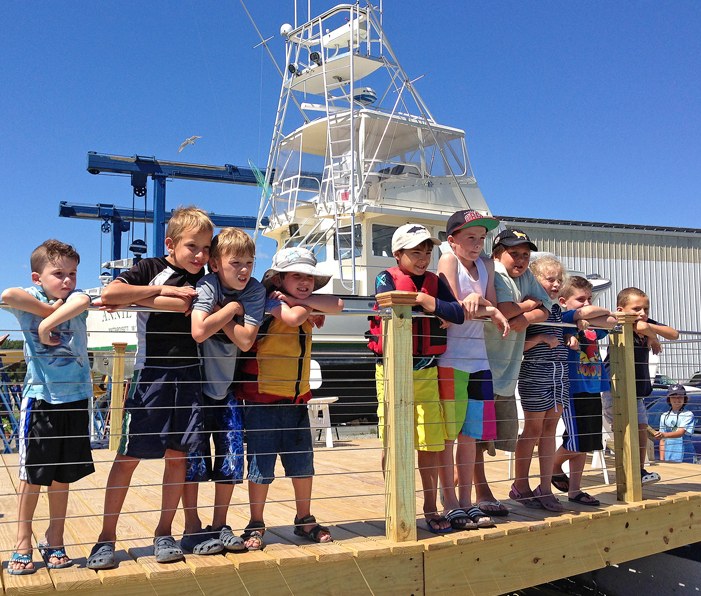 806_2013_contestants_gather_to_hear_results_in_the_off_the_docks_fishing_tournament